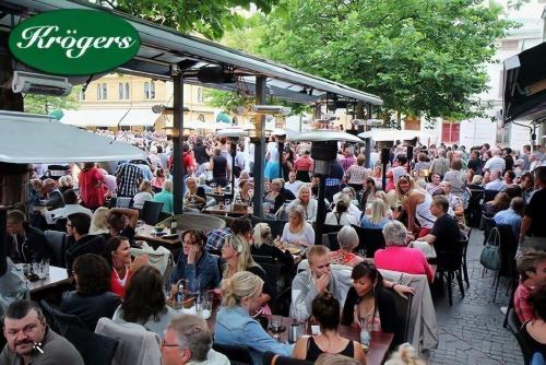 a large crowd of people sitting at tables in a restaurant at Brygghuset, Solviken in Rockneby