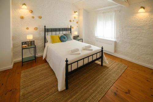 Postel nebo postele na pokoji v ubytování Casa dos Caneiroas