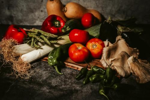 a bunch of fruits and vegetables on a table at Gran Hotel Don Manuel in Cáceres
