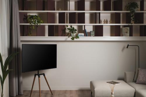 a living room with a tv and a couch at Urban Lofts in Chania Town