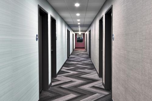 a corridor of an office building with a hallway at Tru By Hilton Beckley, Wv in Beckley