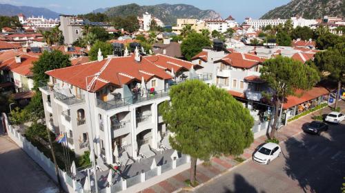 an aerial view of a large white building with a red roof at Arya Otel in Marmaris