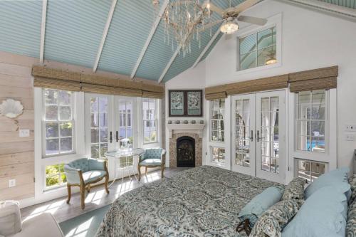 a large bedroom with a bed and a fireplace at Glamorous Cabana in Newburyport