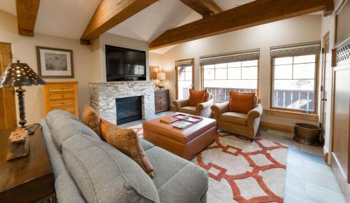 a living room with a couch and a fireplace at Studio Hotel Room in Park City