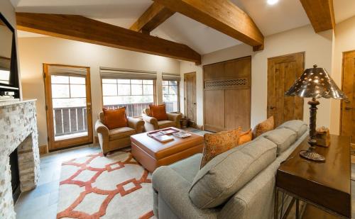 a living room with a couch and a fireplace at Studio Hotel Room in Park City