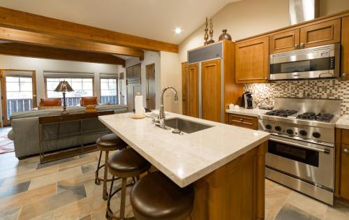 a large kitchen with a sink and a stove at Studio Hotel Room in Park City