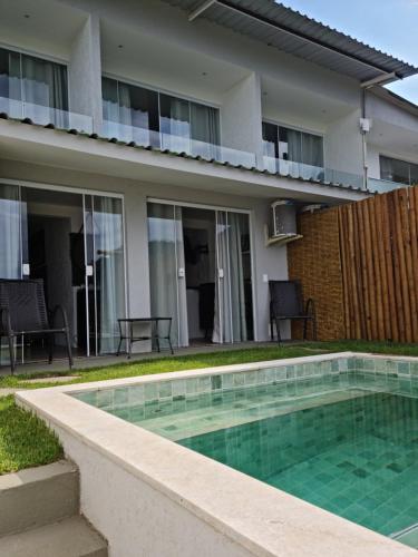 Πισίνα στο ή κοντά στο Alto da Piraquara Flat