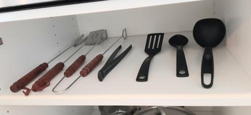 a drawer filled with utensils and cooking utensils at Blue Lagoon in Nehren