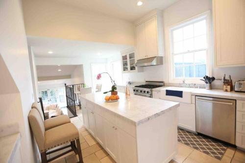 a kitchen with white cabinets and a counter top at Entire villa on Sunset Strip in Los Angeles