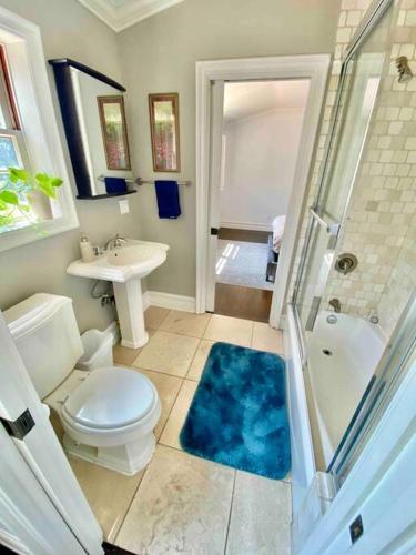 a bathroom with a toilet and a sink and a shower at Entire villa on Sunset Strip in Los Angeles