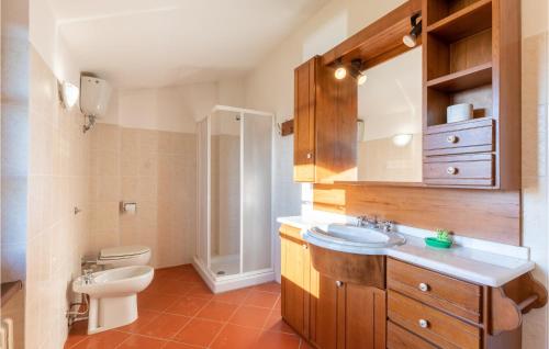 a bathroom with a toilet and a sink and a mirror at Castello Di Tocerano in Monte Santa Maria Tiberina