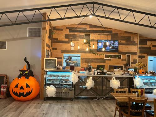 a restaurant with a halloween pumpkin on the counter at Sunglow Motel in Bicknell