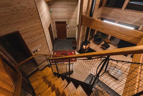 an overhead view of a staircase in a wooden house at Hygge Chalet Hakuba in Hakuba