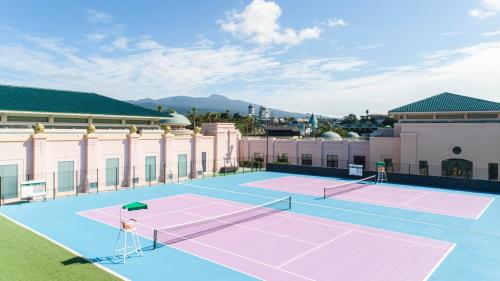 a tennis court on the roof of a building at Lotte Hotel Jeju in Seogwipo