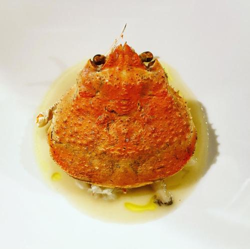 a piece of food sitting on a white plate at 洲本家　SUMOTOYA in Sumoto