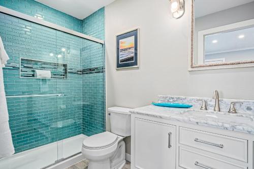 a bathroom with a toilet and a glass shower at Sangria Sunset in Rockport