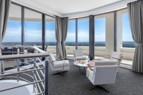 a hotel room with a view of the ocean at Meriton Suites Kent Street, Sydney in Sydney