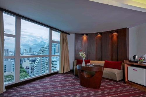 a hotel room with a view of a city at Ambassador Hotel Bangkok - SHA Extra Plus in Bangkok