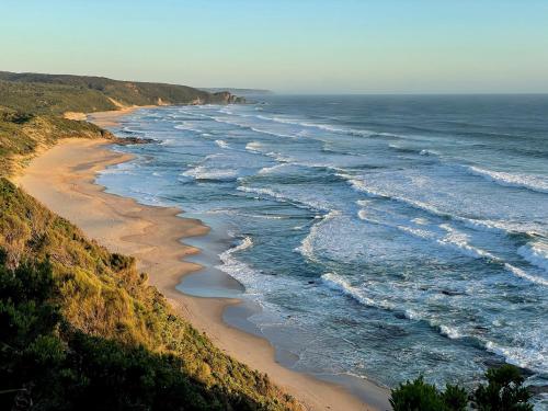 an aerial view of a beach with the ocean at The Roost in Johanna