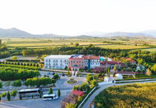 an aerial view of a small town with a road at Gardenland Resort in Shkodër