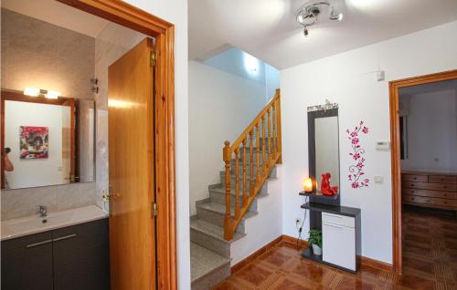 a bathroom with a staircase with a sink and a mirror at Amazing Home In Sils With Wifi in Sils