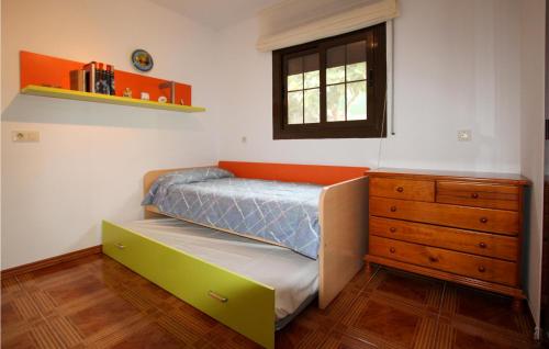 a small bedroom with a bed and a dresser at Amazing Home In Sils With Wifi in Sils