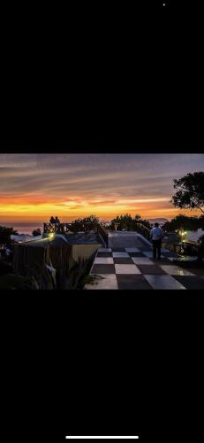 a person standing on a skateboard ramp at sunset at APARTMENT IN MIRAFLORES in Lima