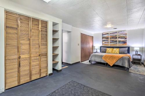 a bedroom with a bed and a closet at Cozy Deadwood Escape Less Than 1 Mi to Dtwn and Casinos in Deadwood
