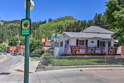 a street sign on a pole in front of a house at Cozy Deadwood Escape Less Than 1 Mi to Dtwn and Casinos in Deadwood