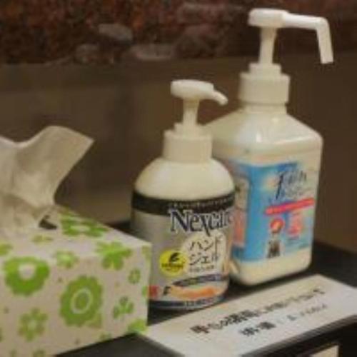 two bottles of bleach and a box on a counter at Saigiku in Iwaki