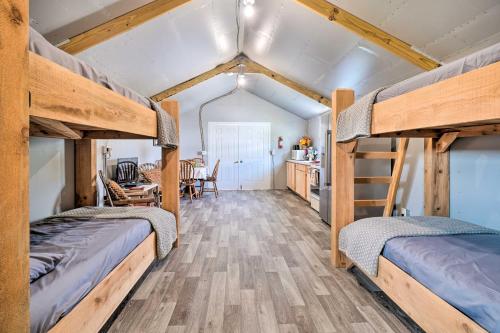 two bunk beds in a room with a kitchen at Dog-Friendly Huntsville Home, ATV Authorized Route in Huntsville