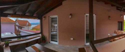 a balcony of a house with a view of the outside at Kuća za odmor CAR - Tekija in Tekija