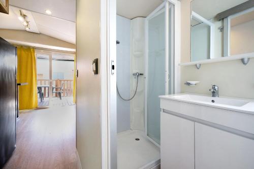 a bathroom with a sink and a shower at Camping Grande Italia Vulcano 7 in Chioggia