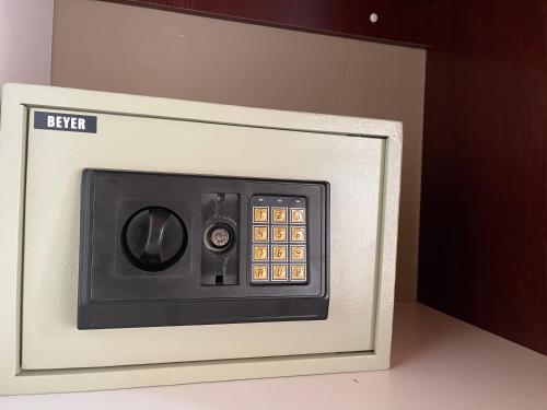 a microwave oven with a control panel on it at Horizon Bed and Breakfast in Roodepoort