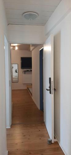 an empty room with a hallway with a door at Blue Lagoon in Nehren
