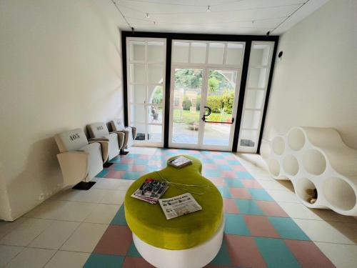 a living room with a couch and a table on a floor at hotel garni Santa Caterina in Orta San Giulio
