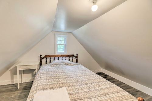 a bedroom with a bed in a attic at Convenient Jacksonville Home with Yard and Patio! in Jacksonville