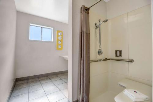 a bathroom with a shower and a toilet at Motel 6-Fort Bragg, CA in Fort Bragg