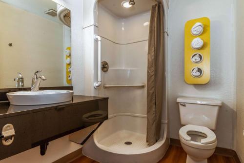 a bathroom with a toilet and a sink at Motel 6-Palm Springs, CA - East - Palm Canyon in Palm Springs