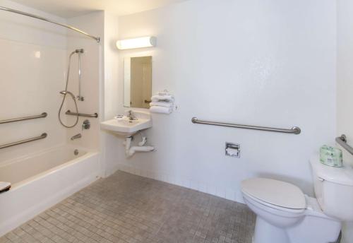 a bathroom with a toilet and a sink and a shower at Motel 6-Rosemead, CA - Los Angeles in Rosemead