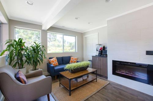 a living room with a couch and a fireplace at Days Inn by Wyndham Monterey-Fisherman's Wharf Aquarium in Monterey