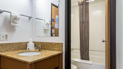 a bathroom with a sink and a toilet at Motel 6-Elk Grove Village, IL in Itasca