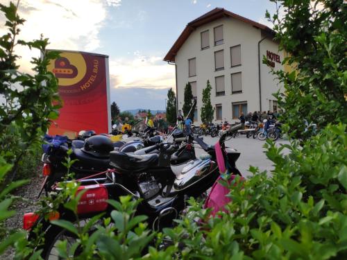 a group of motorcycles parked in front of a building at Hotel Bau Maribor in Maribor