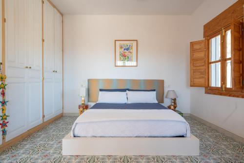 A bed or beds in a room at Casa Nathium.