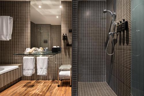 a bathroom with a shower and a sink at Exe Zizur Pamplona in Zizur Mayor