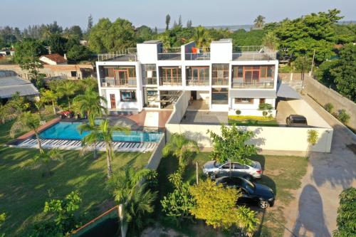 an aerial view of a house with a car at Moringa Hotels in Matola