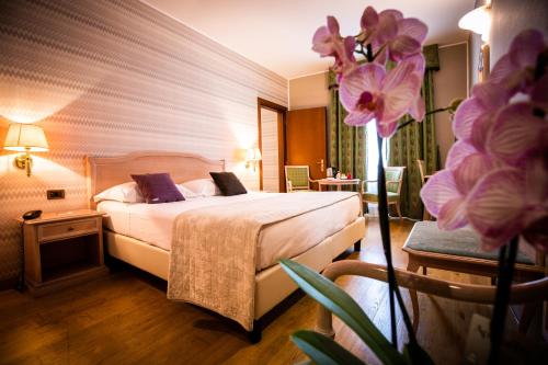 Postel nebo postele na pokoji v ubytování Hotel Palazzo Lovera
