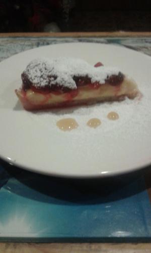 a piece of food on a plate on a table at Hotel Etoile De Neige in Valtournenche