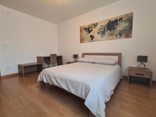 Postel nebo postele na pokoji v ubytování Nido della Poiana - Attico PANORAMICO