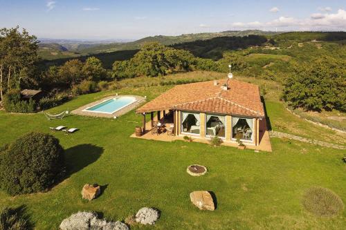 an aerial view of a house with a swimming pool at Villa Borgiano - Happy Rentals in Scansano